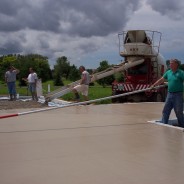 Photo of Workers pouring the Concrete.